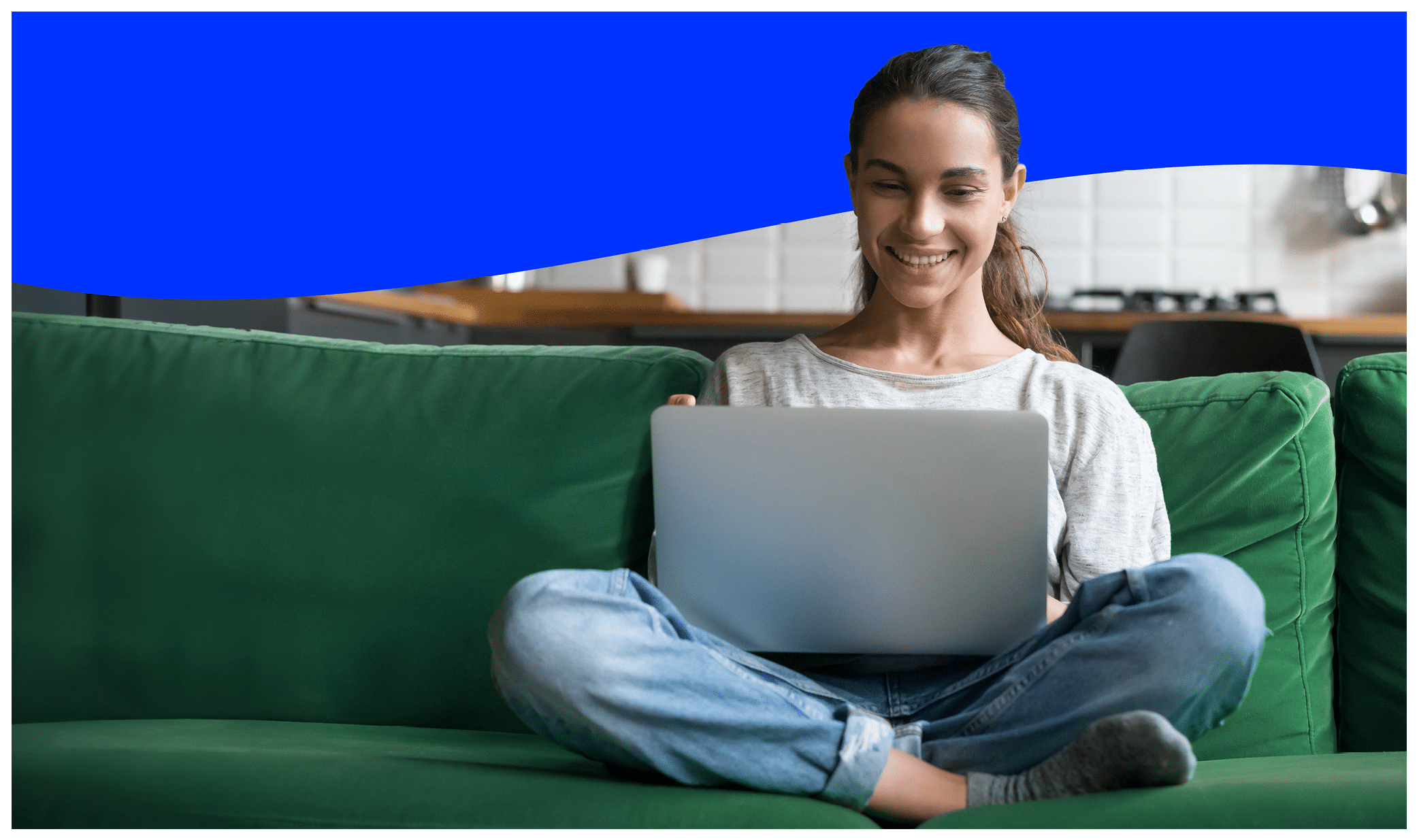 Happy smiling woman sitting on sofa, couch and using laptop at living room at home, watching funny video, learning language, video calling, mother working online